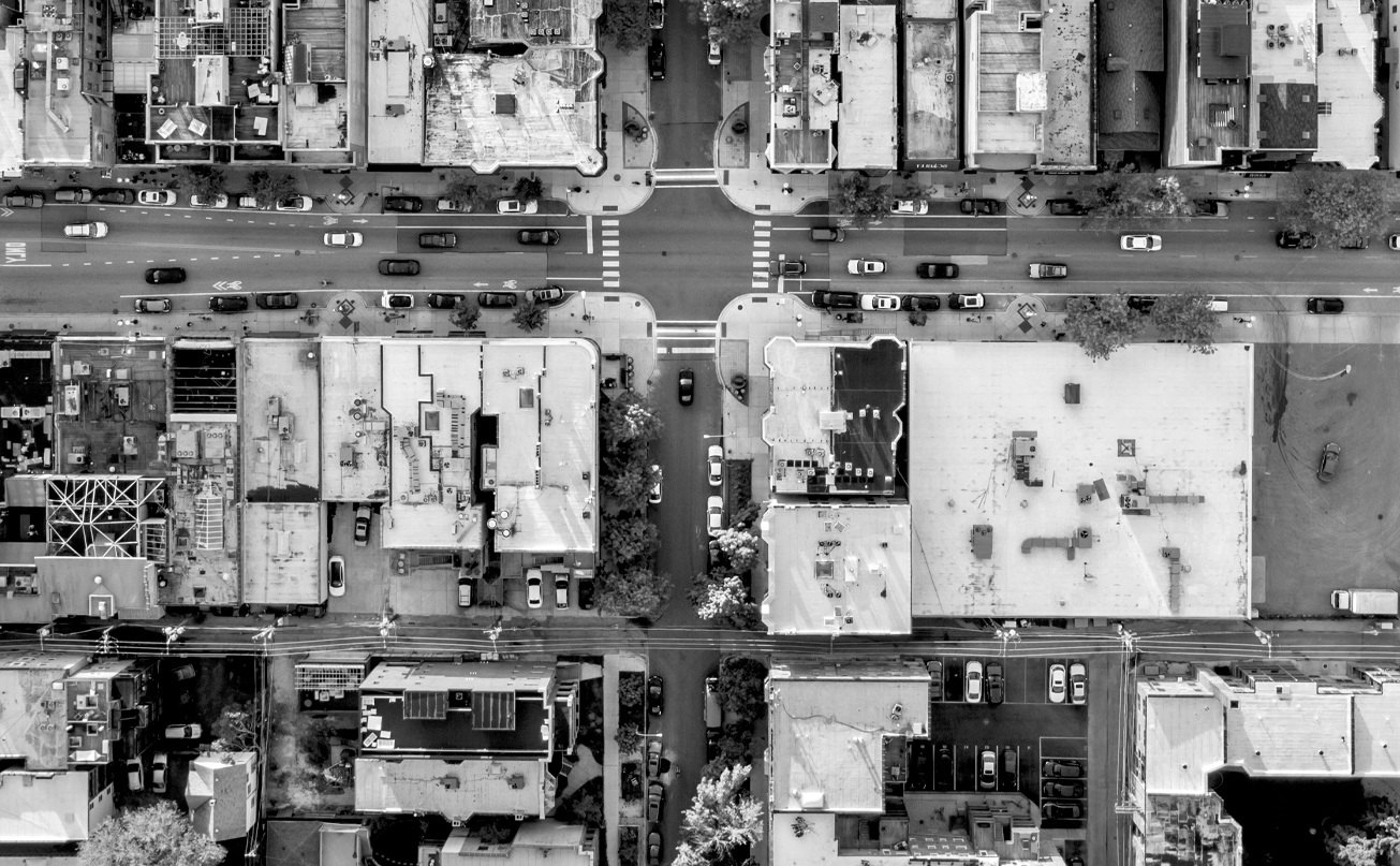 Top down photo of a city grid, aligning with the circuit board